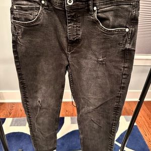 Men’s black deconstructed jeans